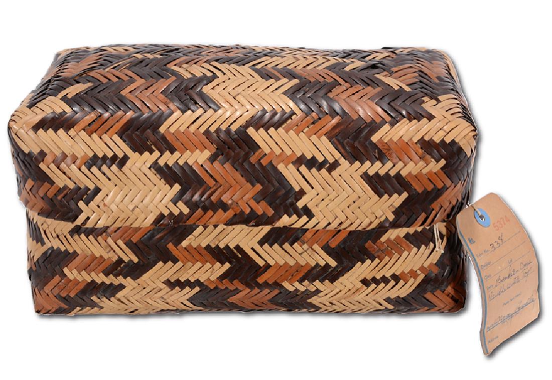 Nancy Bradley. Double Weave Rivercane Basket With Lid.: Nancy Bradley Double Weave Rivercane Basket With Lid. Signed on attached tag. Naturally dyed river cane. Excellent condition. 12" x 7" x 6.5". Provenance: Museum of The American Indian, Cherokee, N.C.