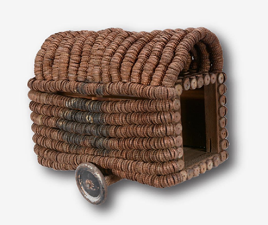 Clarence Woolsey. Bottlecap Covered Wagon.: Clarence Woolsey. Bottlecap Covered Wagon. Not signed or dated. Bottlecap, wire, wood, paint on old fruit crate construction. Excellent condition. 19"long x 17"h x 14"w . Provenance: Leslie Muth priva