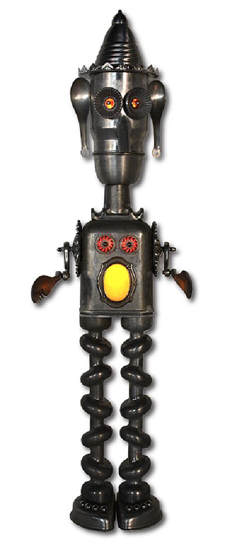 Jim Bauer. Tall Robot Light Man.: Jim Bauer. Tall Robot Light Man. 2003. J.B. 218. Signed and dated. Electrified with working lights. Aluminum scap pieces and found kitchen ware construction. Excellent condition. 53"h x 15" x 8". Prov