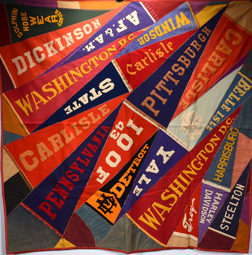 Old Wool and Felt College Pennant Quilt.: Old Wool and Felt College Pennant Quilt. Hand-sewn with large cross stitch connecting mostly Ivy League college pennants with rayon backing. Mid-weight quilt. Great condition. 70" x 70". Est. $1,000-2
