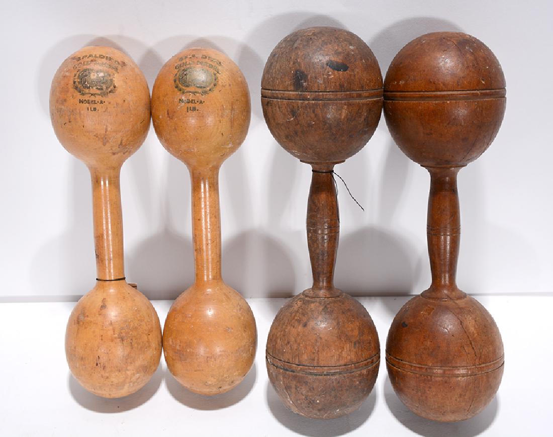 Pair of Wooden Bar Bells.: ﻿Pair of Wooden Bar Bells. One pair is stamped. Both are in good condition. Average size is 10” h. Provenance: The Ames Gallery. Est. $200-300. Ship: $35