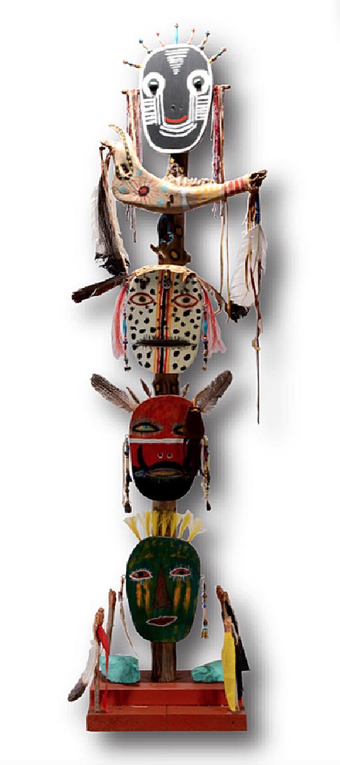 Native American Inspired Totem.: ﻿Fred ____Native American Inspired Totem. Signed. Not dated. Wood, feathers, bone and mixed media construction on wooden post. Excellent condition. 66” h x 16” x 13”. Es