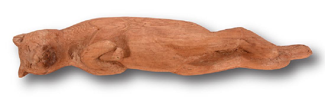 Paul Cummines. Sleeping Cat.: ﻿Paul Cummines. Sleeping Cat. Signed. Not dated. Carved natural wood. Missing part of ear, otherwise good condition. 27” long x 7” w. Est. $100-200. Ship: $55
