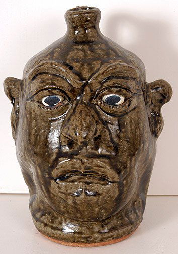 Lanier Meaders Face Jug: Face Jug. Tobacco-spit glaze. 9.5" h. c. mid-1980's. Mint condition. Est. $1,000 - $2,000. Ship: $35