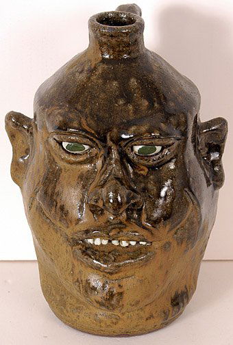 Lanier Meaders Tall Face Jug: Tall Face Jug. 11" h. Matte glaze. Mint condition. Est. $1,000 - $2,000. Ship: $35