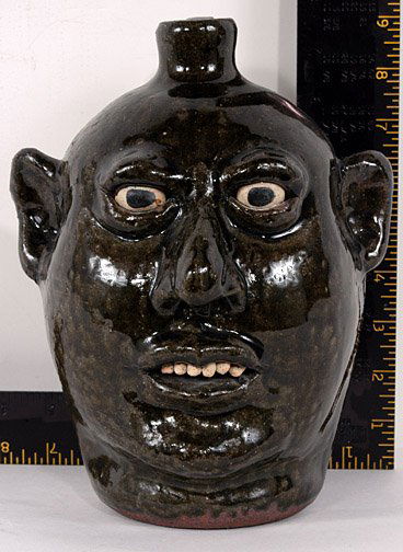 Lanier Meaders Face Jug with Thick Glassy Glaze: Face Jug with Thick Glassy Glaze. Alkaline glaze. Mint condition. Est. $1,000 - $2,000. Ship: $35