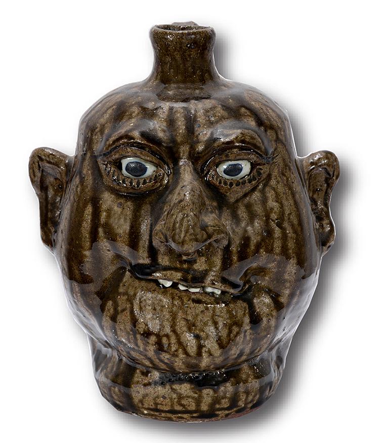 Lanier Meaders. Grinning Smile Face Jug.: Lanier Meaders. Upward Grinning Smile Face Jug. c. 1980s. Signed. Great tobacco-spit glaze. Mint condition. 10"h. Est.$800-1,200. Ship:$45
