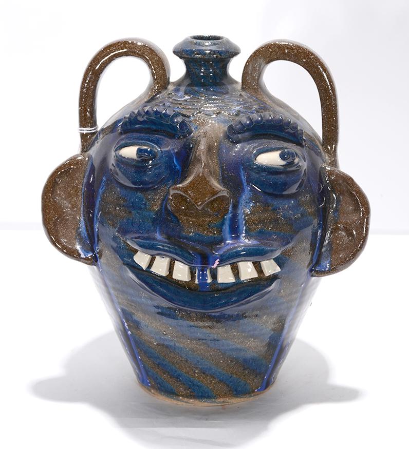A.V. Smith. Swirl Crying Eye Face Jug.: A.V. Smith. Swirl Crying Eye Face Jug. Signed. Mint condition. 10"h. Est.$200-300. Ship:$45