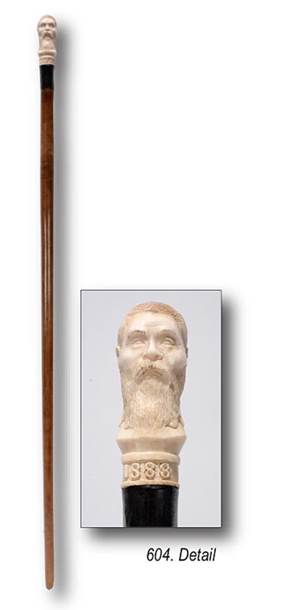 Antique Bone Head Folk Art Walking Stick.: Antique Folk Art Walking Stick. Finely Carved Bone Head Handle. 1888. Dated at top. Smooth carved wooden shaft, silver ferrule, carved bone. Excellent condition. Est. $500-800. Ship:$35