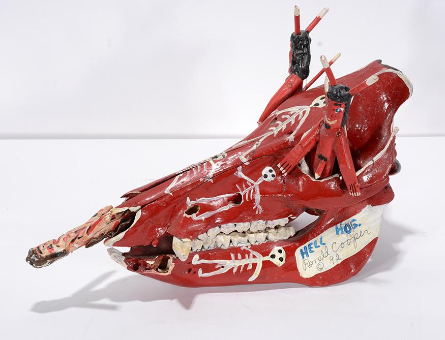 Ronald Cooper. Hell Hog.: Ronald Cooper. Hell Hog. 1992. Signed, dated and titled. Painted skull and carved figures. Great condition. 7” x 12” x 4”. Est. $200-300. Ship:$45