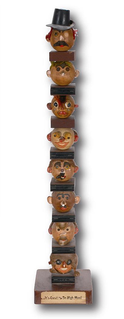 It’s Great To Be High Man! Totem.: Anonymous It’s Great To Be High Man! Wood ball heads with mixed media attached. Some minor loss through out, otherwise good condition. 36” h x 7” x 7”. Est. $200-300. Shi