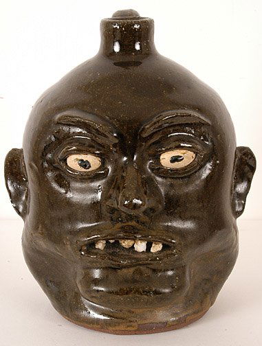 Lanier Meaders. Rock Tooth Face Jug: Signed. One rock tooth flaked during the firing, otherwise mint condition. 10" h. Est. $2,000 - $3,000. Ship: $40