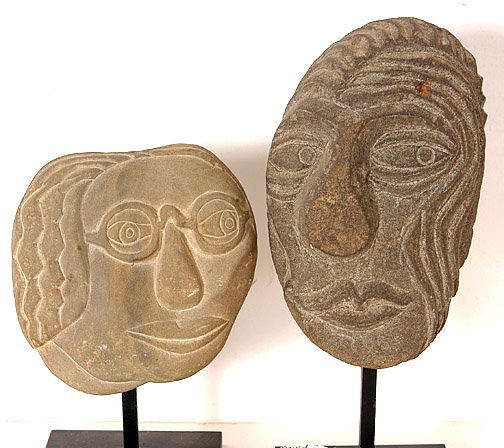 David Marshall .Two Stone Heads: Carved stone with metal base. Largest: 8" x 3" x 2.5". Est. $400 - $600. Ship: $35