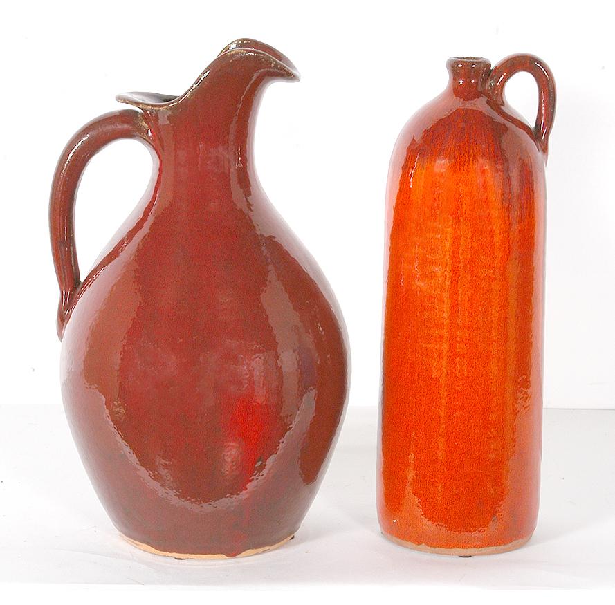 A.V. Smith. Pitcher and Wine Jug.: A.V. Smith. Pitcher and Wine Jug. Signed. Not dated. Beautiful red orange glaze. Mint condition. 14.5" h. Est. $200-300. Ship: $100