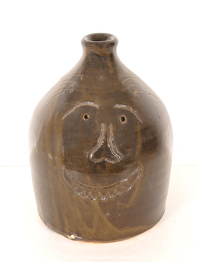 Miller Pottery (attrib). Early Whiskey Jug With Face. (1 of 1)