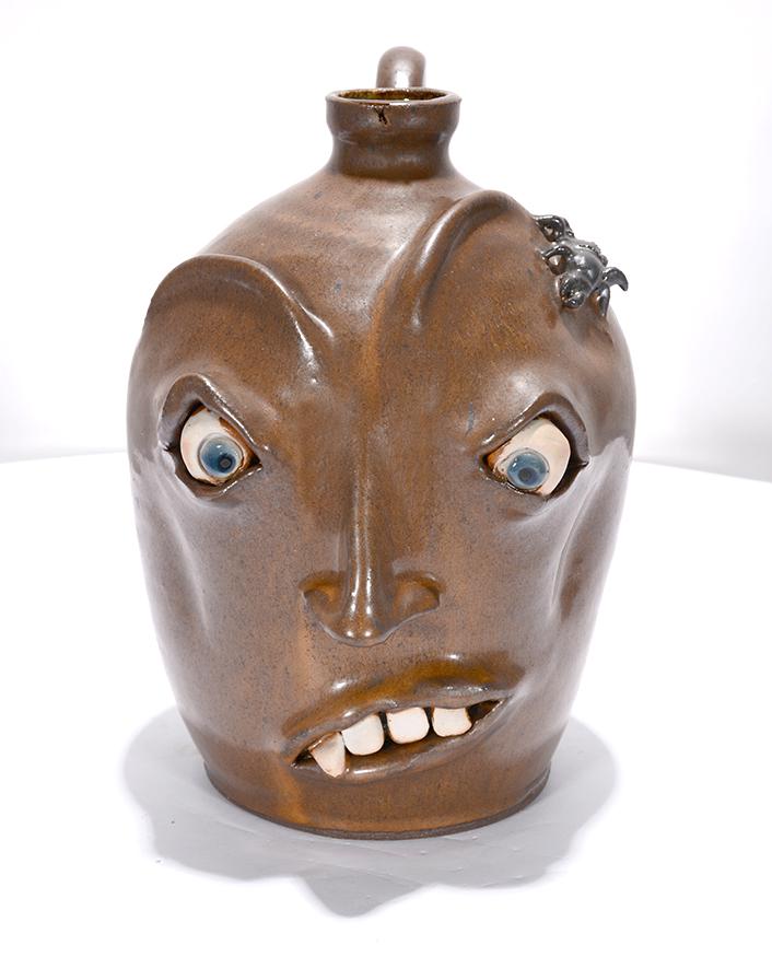 Lance & Barbaree Potluck Pottery. Face Jug w Spider. (1 of 3)