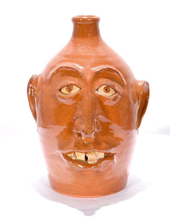 David Farrell, Westmore Pottery. Orange Face Jug. (1 of 3)