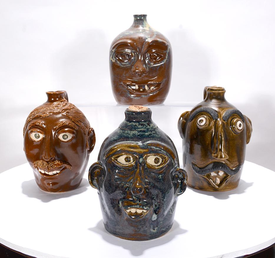 Four Face Jugs. (1 of 1)