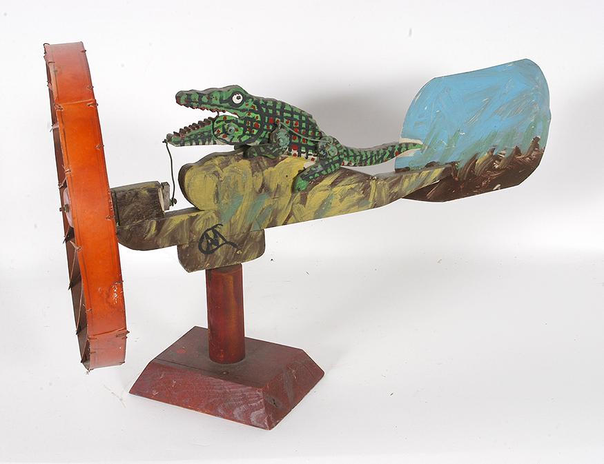Alligator Whirligig.: Unknown Artist. Alligator Whirligig. Initialed. Paint on wood with tin. Great condition. 16" x 13" x 25" including stand. Provenance: ex. Herbert W. Hemphill Collection. Est. $100-200. Ship: $125