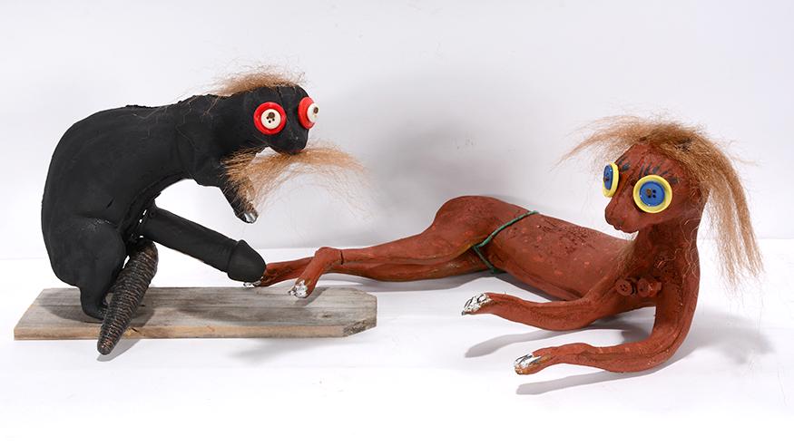 Jerry Peters. Erotic Pole Cats.: Jerry Peters. Pair of Button Eyed Erotic Pole Cats. Not signed. Carved and painted wood with mixed media. Great condition. Average size is 8” x 15”. Est. $200-400. Ship: $65