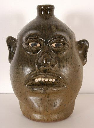 Lanier Meaders, Chubby Cheek Face Jug.: c. early 1980's. Signed on bottom. 10.25"h. Mint condition. Est. $1,200 - $2,000. Ship: $50