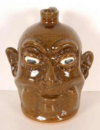 Lanier Meaders, High Cheeks Face Jug.: c. mid 1980's. 9"h. Signed on bottom. Mint condition. Est. $1,000 - $2,000. Ship: $50
