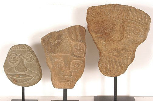 David Marshall, Stone Heads.: Carved stone mounted on metal display stands. All are in excellent condition. The middle carving is dated 1984. The smallest is 4" h and the tallest is 7.5"h. Est. $1,000-1,500. Ship: $40