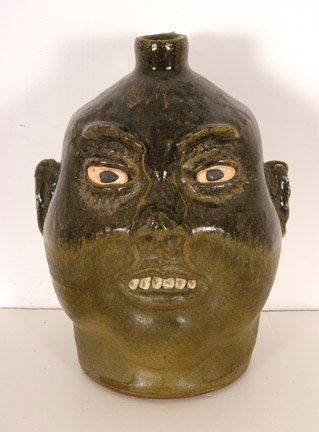 Lanier Meaders. Large Face Jug.: Circa late 1970's. Clay teeth. Half gloss, half matte glaze. Signed on bottom. 10.5"h. Mint condition. Est. $1,000-2,000. Ship: $45
