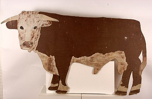 Bull Trade Sign: Paint on cut out board. 7 ft. 3" x 48". Provenance: The Wenstrup Collection. The piece was propped up in the middle of a field below the Wenstrup's house, visible from the large windows in their livin