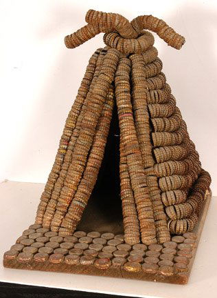 Clarence Woolsey. Indian Teepee.: Bottlecap and wood construction. 19" x 14" x 18". Excellent condition. Provenance: Shelley Zegart. Est. $500-1,000. Ship: $75