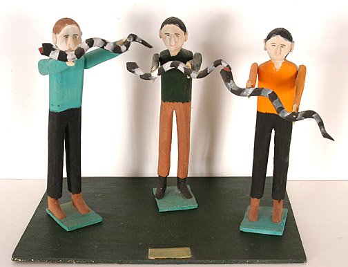 Fred Webster. Snake Handlers.: Carved and painted wood. Figures are 10" h each. The display board is separate and is 12.5" x 9". Board is signed and dated, 1992. Good condition. Est. $300-500. Ship: $40