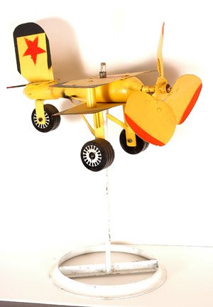 Vollis Simpson. Airplane Whirligig.: Painted wood and metal on metal stand. 20" x 14" x 13". Est. $200-300. Ship: $75