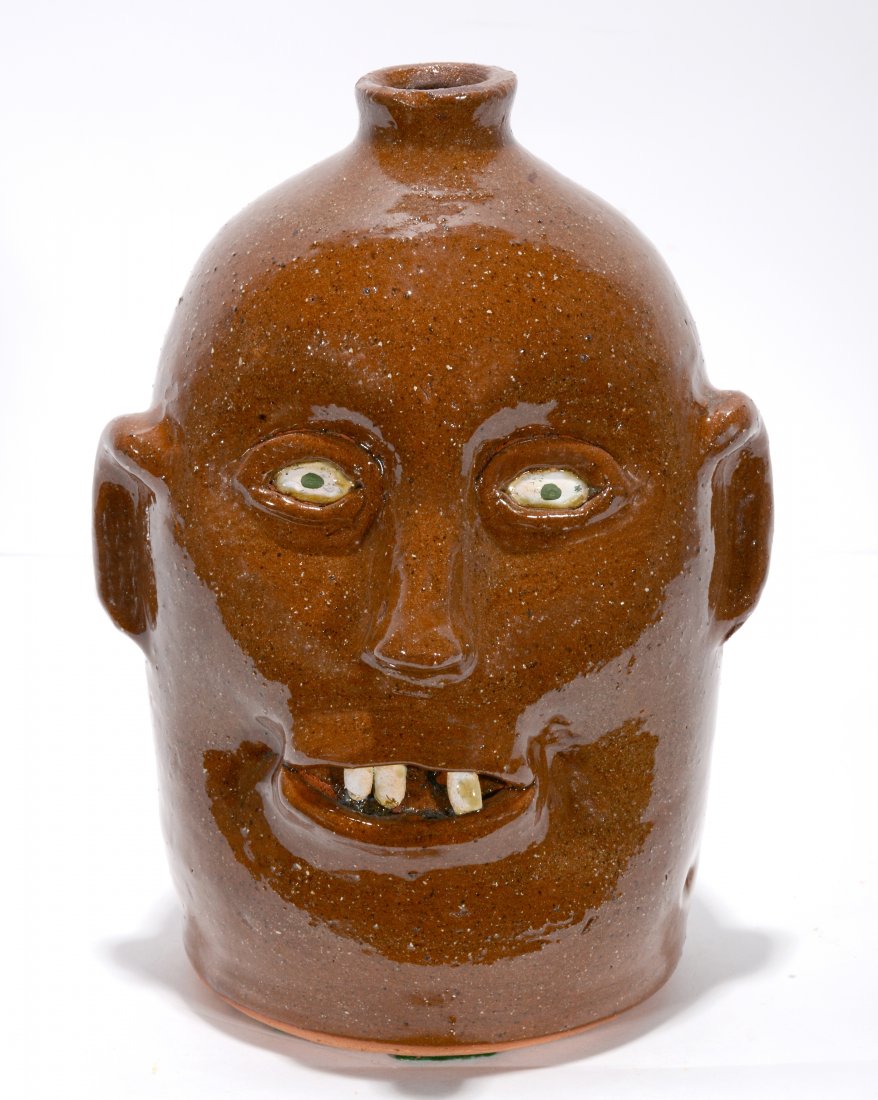 Reggie Meaders. Tooth Fairy Face Jug.: Reggie Meaders. Tooth Fairy Face Jug. Signed. Missing front teeth, otherwise excellent condition. 10"h. Est. $300-500. Ship: $45