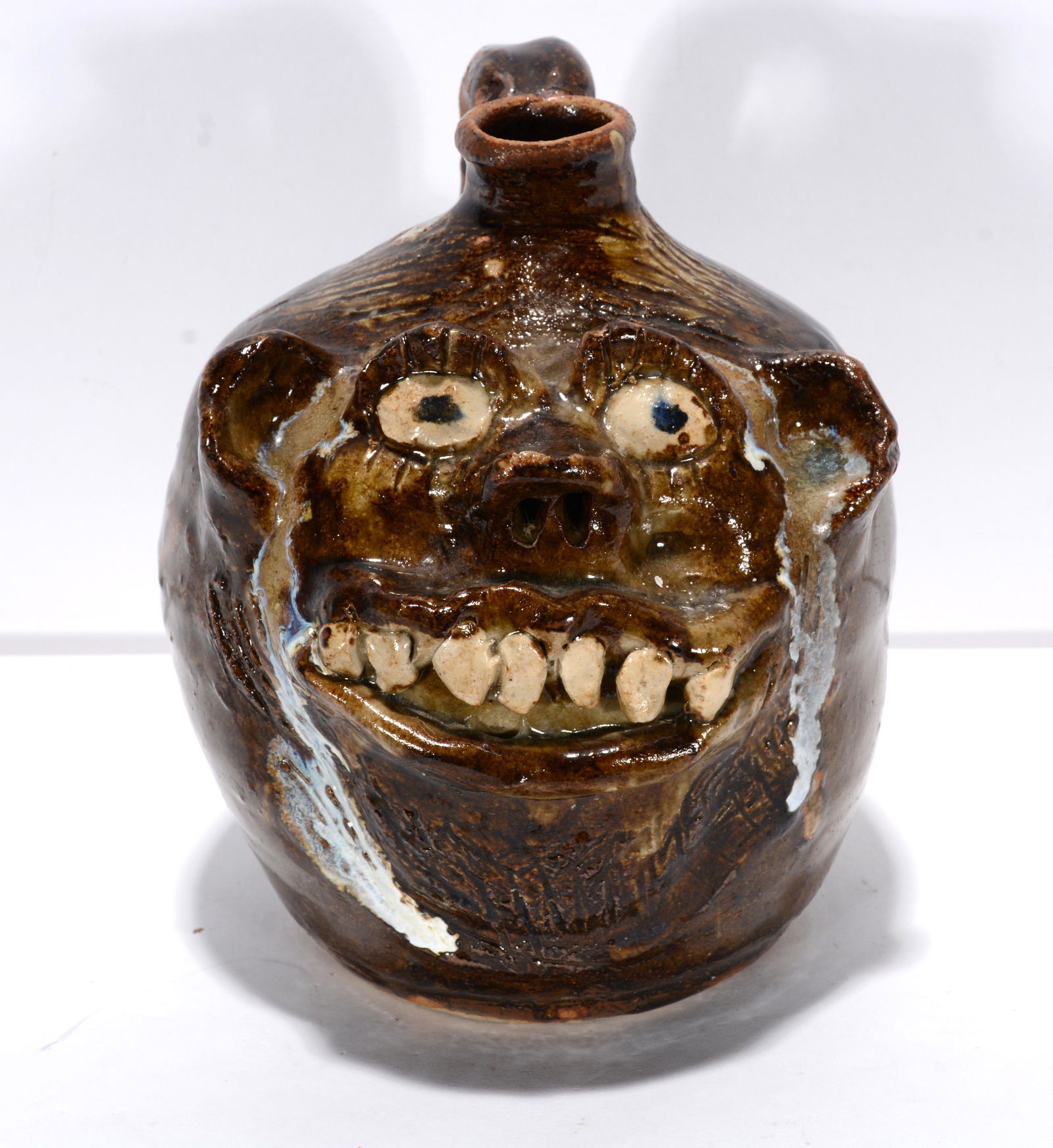 Marie Rogers. Pint Size Face Jug With Drips. (1 of 3)
