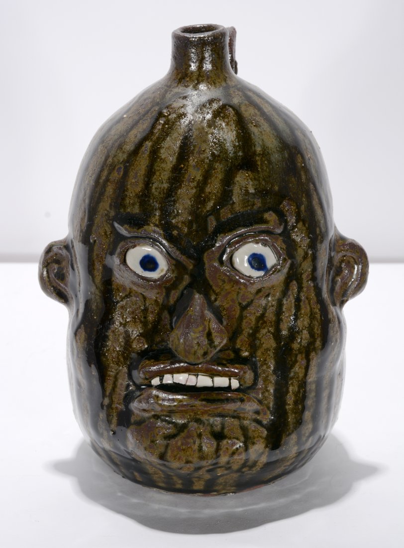Nathan Hewell. Face Jug with Tobacco Spit Glaze.: Nathan Hewell. Face Jug with Tobacco Spit Glaze. 1999. Signed. Mint condition. 9.5"h. Est. $100-200. Ship: $45