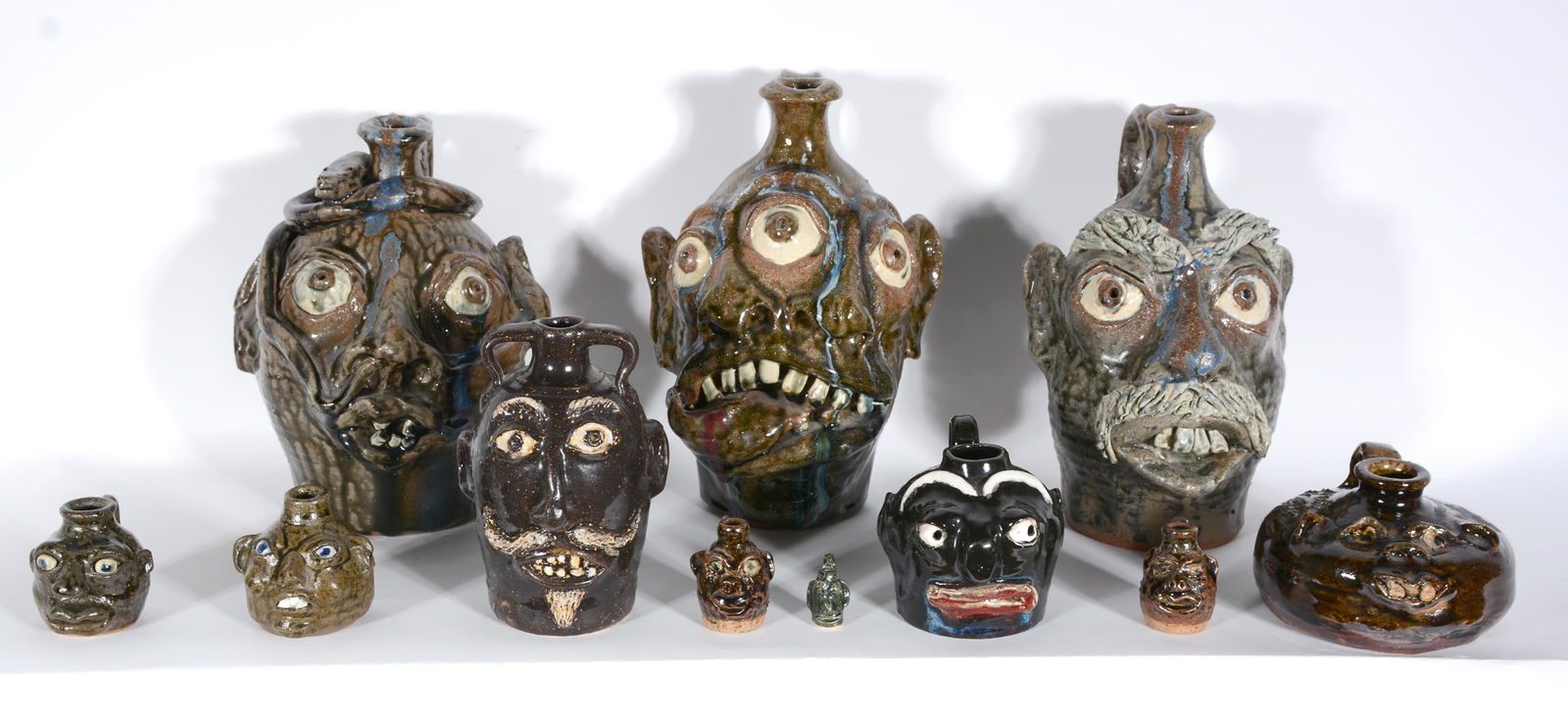 Flowers, Rogers, Jackson & Hewell. 11 Face Jugs. (1 of 4)