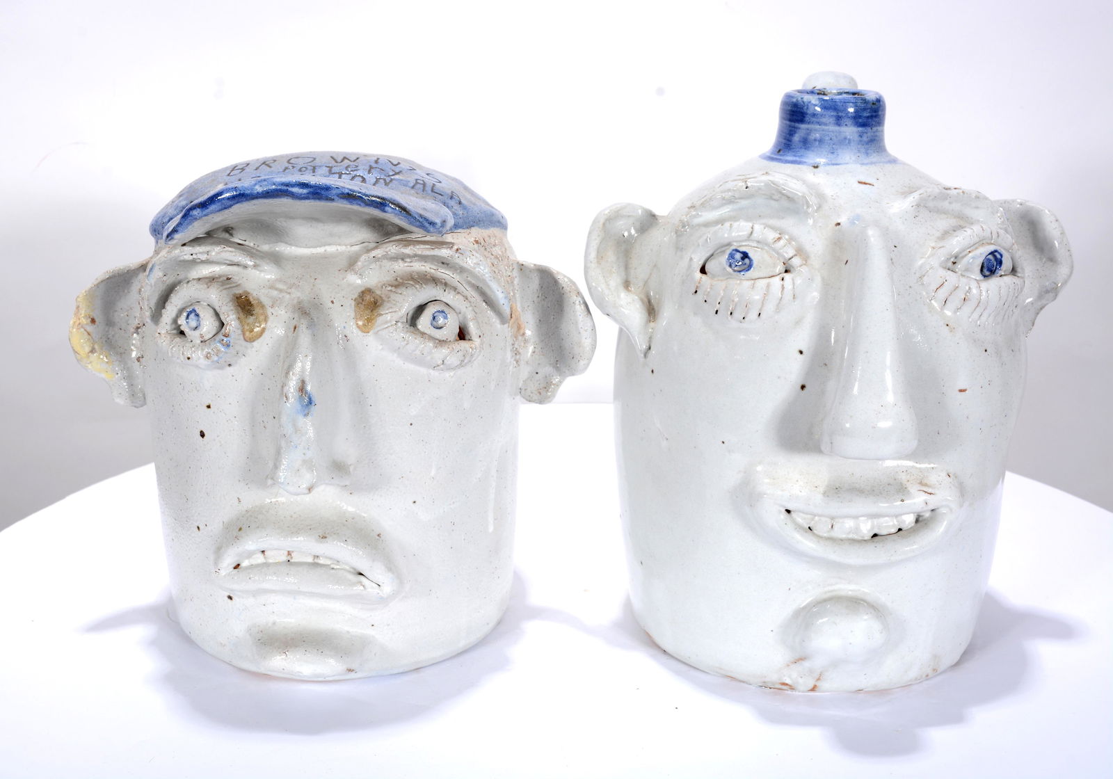 Jerry Brown. White Face Jugs With Blue Cap & Rim. (1 of 3)