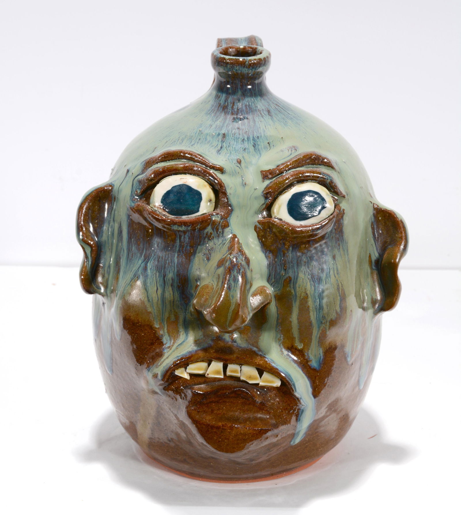 A. Solemon. Drippy Glaze Face Jug. (1 of 2)
