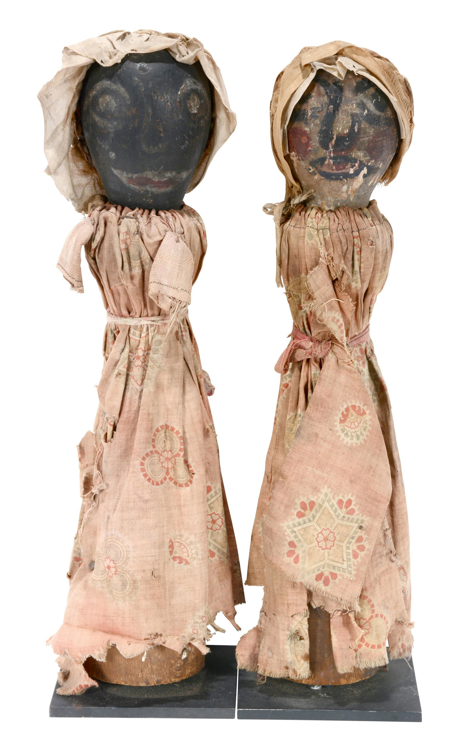 Rare Afro-American Knock Down Punk Figures.: Rare Afro-American Knock Down Punk Figures. c. 1900s. Carved and painted wood with homemade dresses and hats. Original paint, clothes and metal hinges. Expected wear from use and age. Great condition.