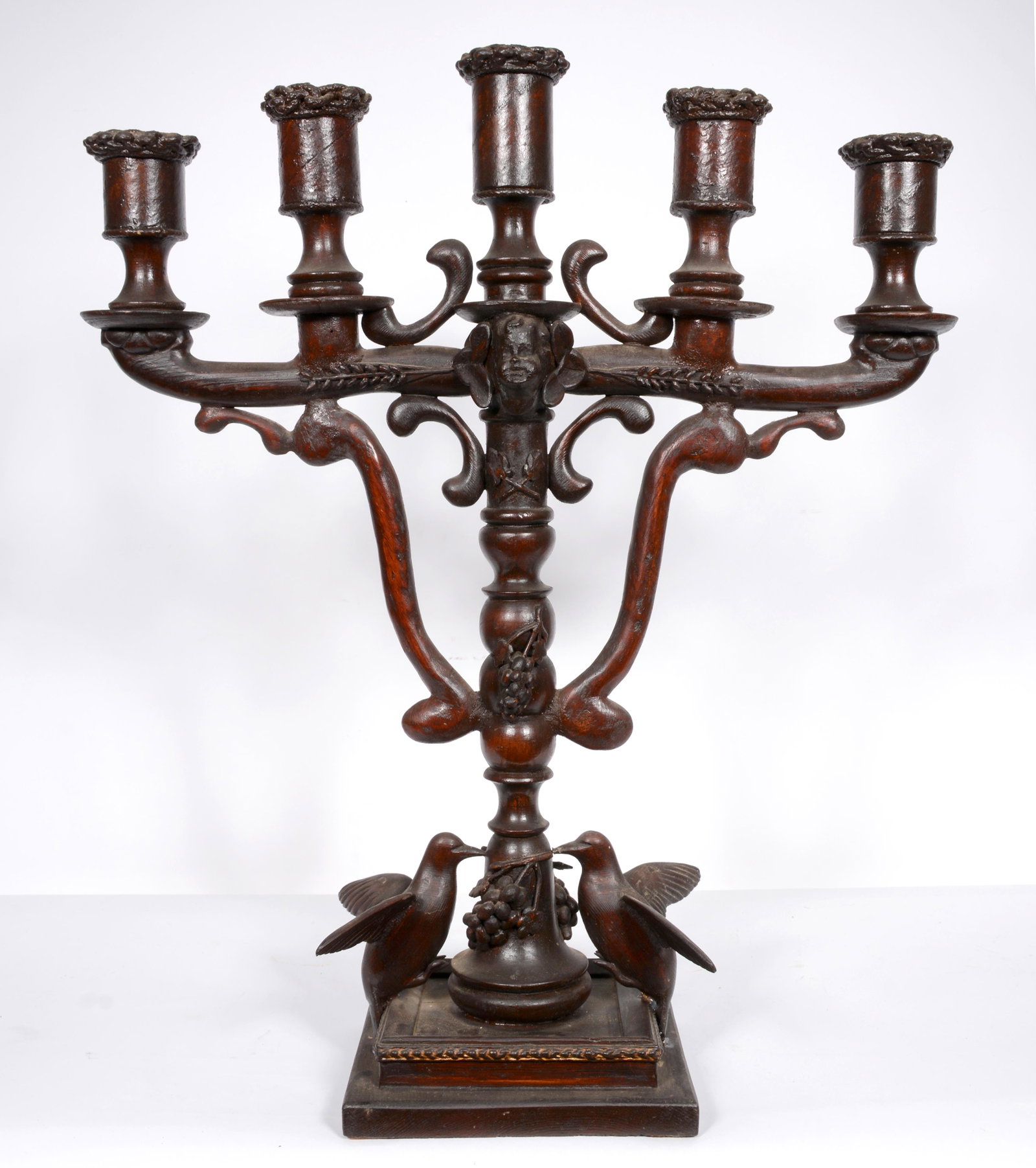 Rev. Joel D. Hewlett. Double-sided Candelabra With: Rev. Joel D. Hewlett. Double-sided Candelabra With Humming Birds and Grapes.Not signed. Carved and stained wood with mixed media. One bird has been re-attached, otherwise great condition. 22.5"h x 19"