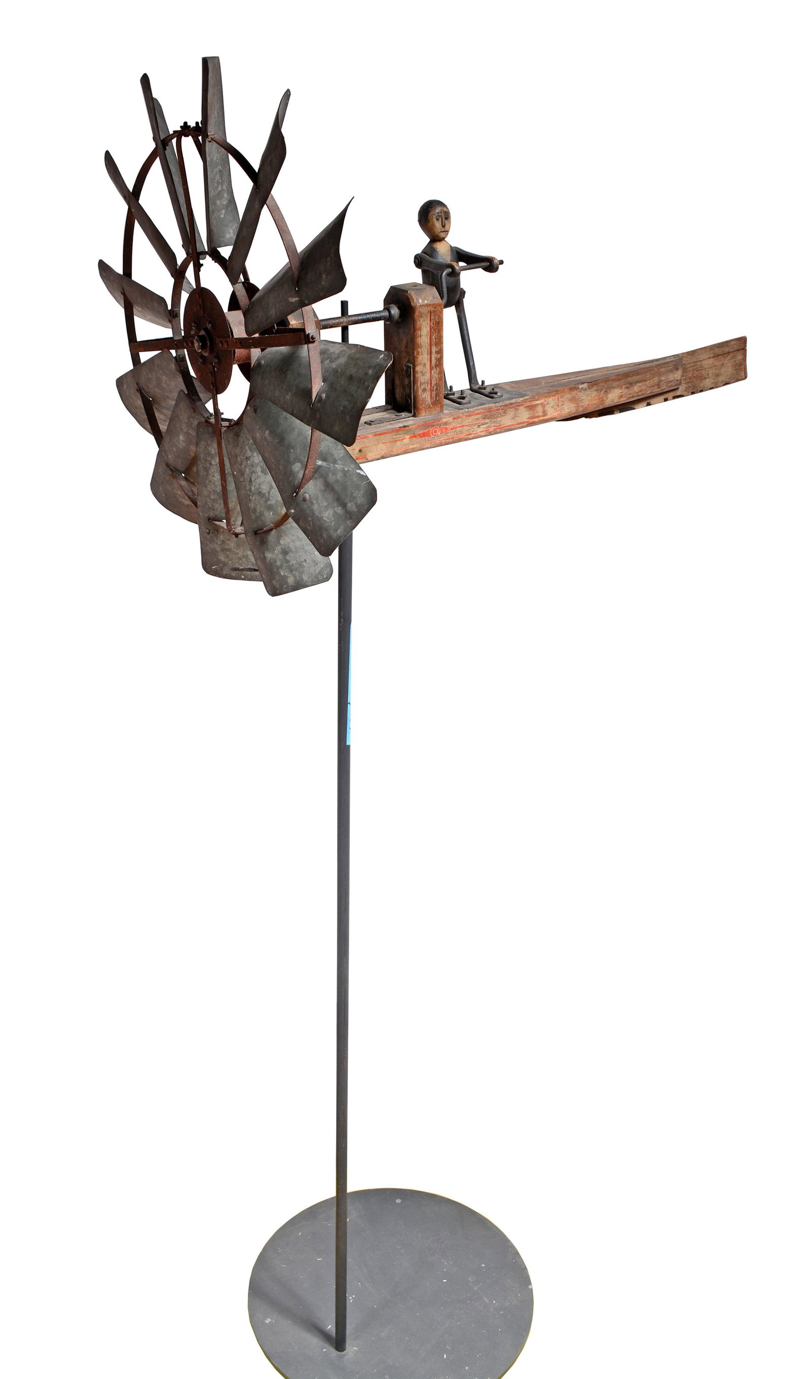 Windmill With Articulated Figure.: Anonymous Windmill With Articulated Figure. c. 1930. Midwest origin. Blade is 24" diameter. Figure is 10" h x 3" w x 3" d. Overall length is 38" w x 79" h with stand. In good as-found condition. Est. 
