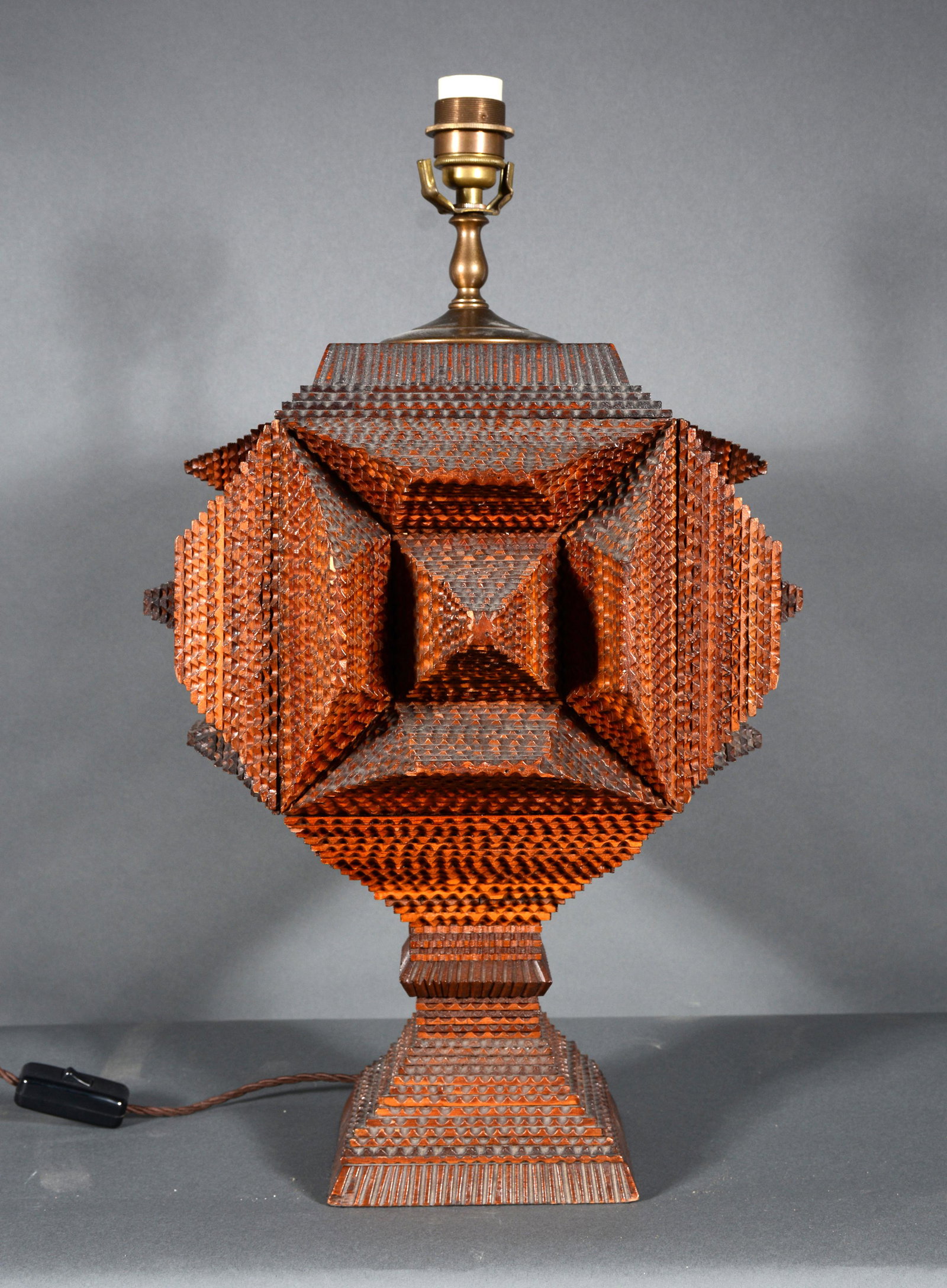 Stout Four-Sided Tramp Art Pyramid Lamp.: Stout Four-Sided Tramp Art Pyramid Lamp. c. 1900-20s. Carved and stained wood. Tiny chip on side, otherwise excellent condition. 17.5" h x 14" diameter. Est. $1,000-2,000. Ship: $85