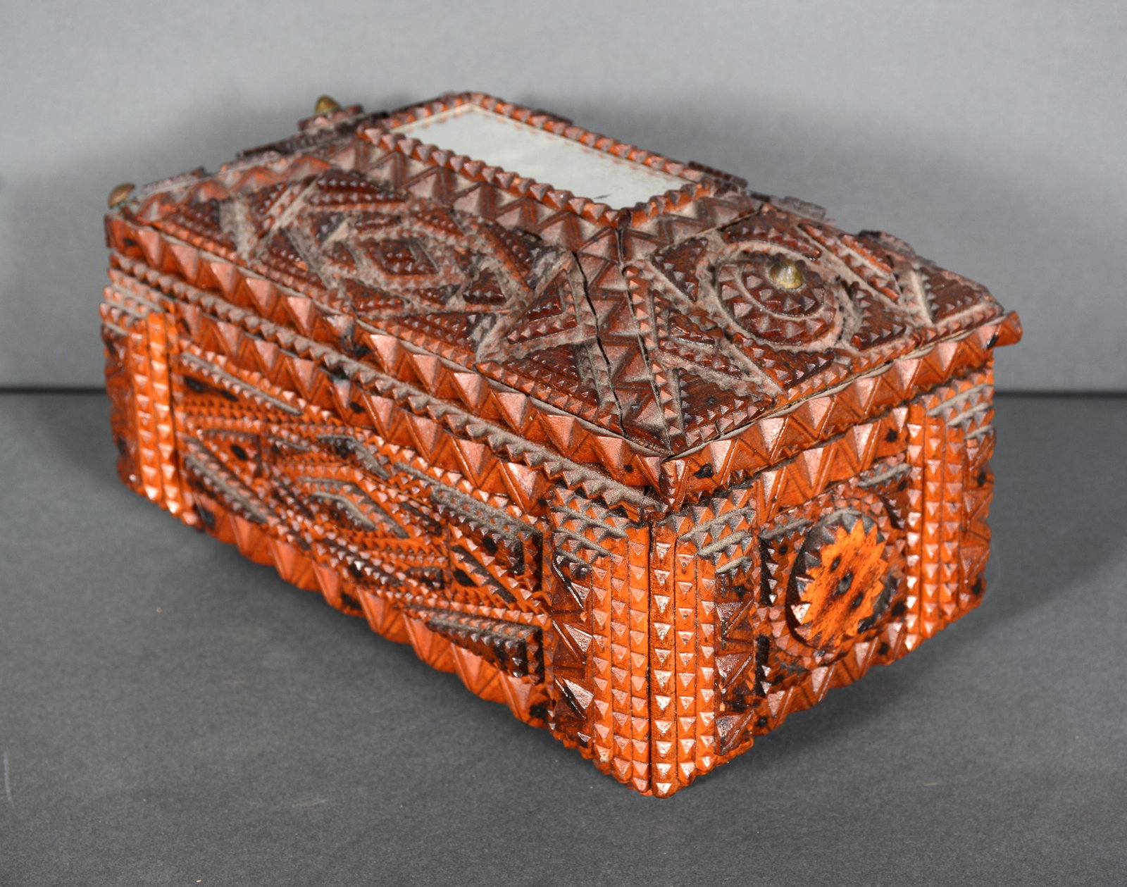 Tramp Art Box With Mirror On Top & Delicate Details.: Tramp Art Box With Mirror On Top & Delicate Details. c. 1900. Carved and stained wood with mirror. Excellent condition - Missing one of four corner brass tacks. 6.5" h x 10.5" x 8.5". Provenance: The 