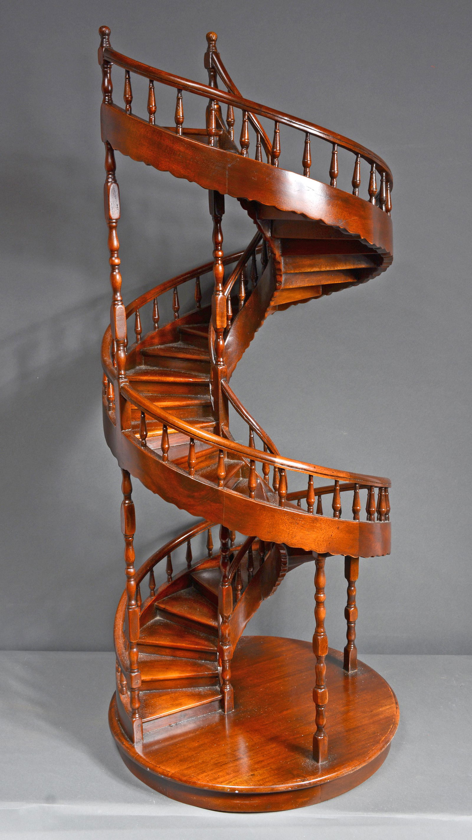 Architectural Spiral Staircase Model.: Architectural Spiral Staircase Model. Not signed. Carved and stained wood. Minor loss to one post, otherwise great condition. 41" h x 17"d. Est. $1,000-2,000. Buyer is responsible for shipping.