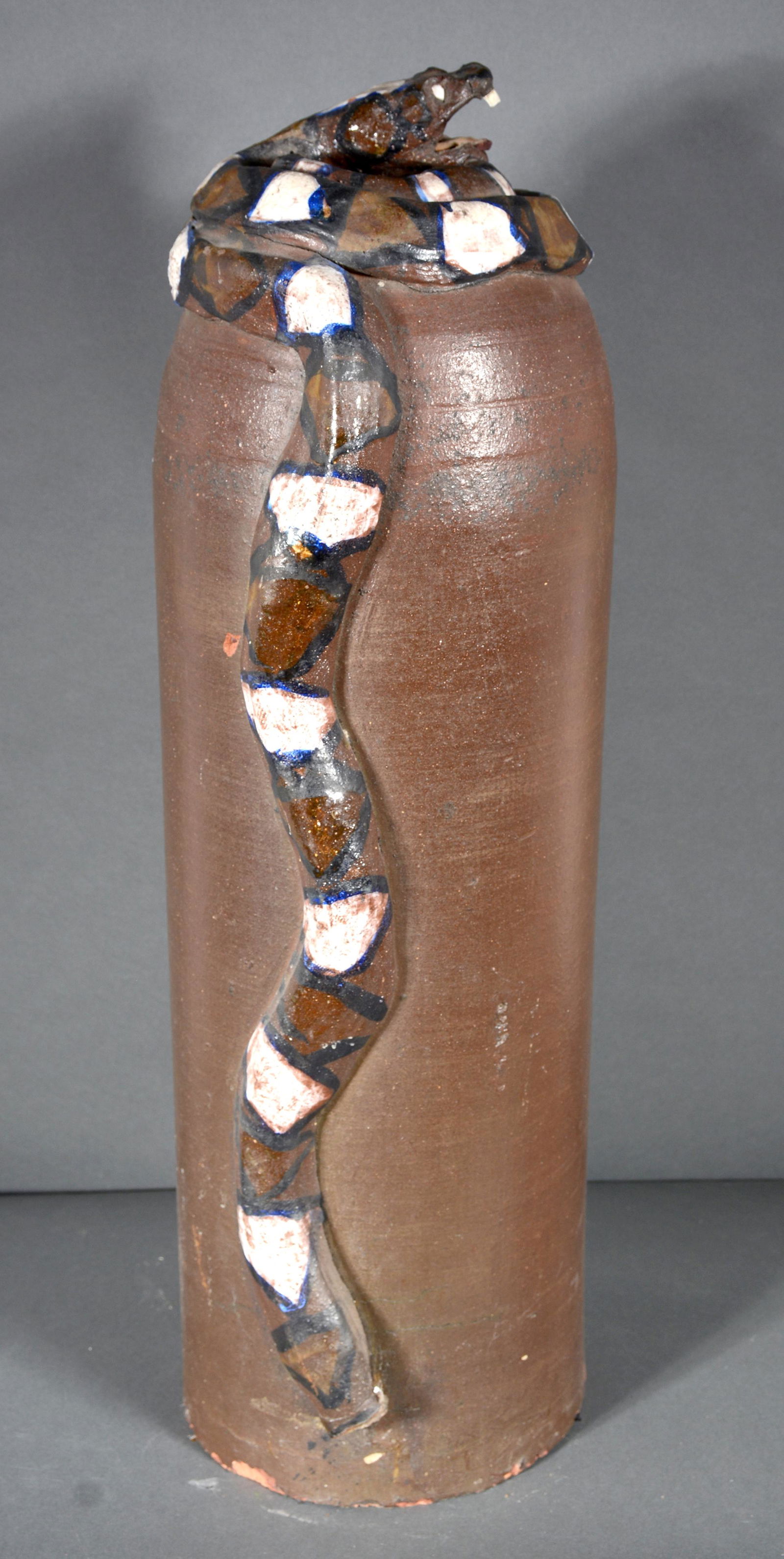 End Of The Day Sewer Tile Pipe With Snake.: End Of The Day Sewer Tile Pipe With Snake. c. 1950s. Not signed. Sewer tile clay with painted snake. Loss to tail and fang, otherwise good to great condition. 31" h x 9.5" diameter. Est. $150-250. Buy