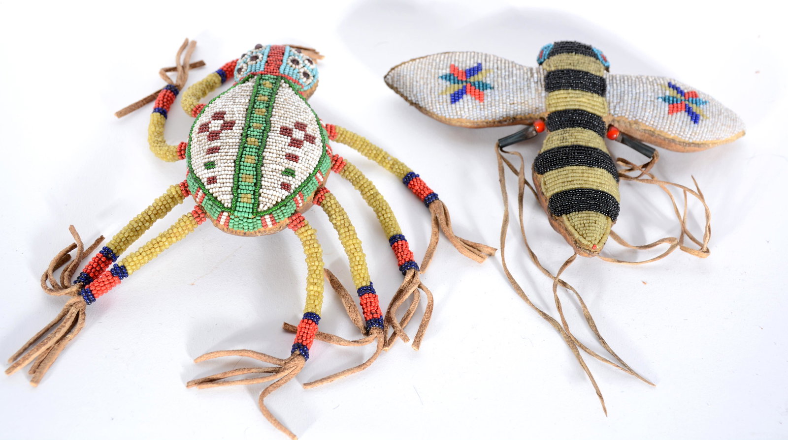 Native American Spider & Bee Umbilical Cord Holders.: Native American Spider & Bee Umbilical Cord Holders. Not dated. Glass beads on tanned hides. Overall good to great condition. Average is 8" x 8". Est. $300-500. Ship: $35