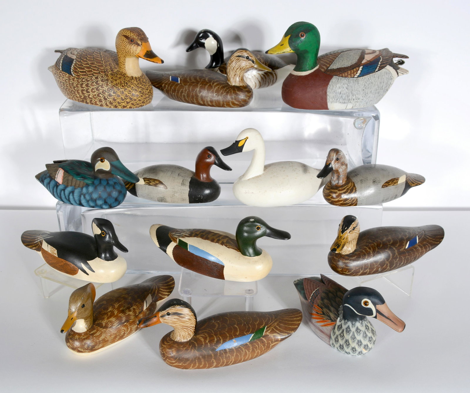 Herb Daisy & Laurence Earhart. 14 Mini Duck Decoys.: Herb Daisy, Jr. & Laurence Earhart. 14 Mini Duck Decoys. All are signed. Not dated. Carved and painted wood. All in great condition. Largest is 9" x 14". Est. $200-300. Ship: $65