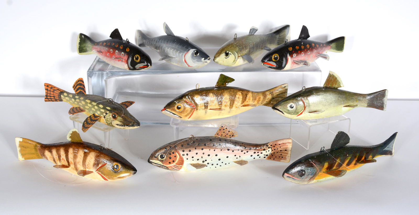 Tom Singleton. 10 Fish Decoys (C).: Tom Singleton. 10 Fish Decoys (C). Initialed. Carved and painted wood with tin fins and weighted bottoms. All in great condition. Average size is 8" long. Est. $200-300. Ship: $45