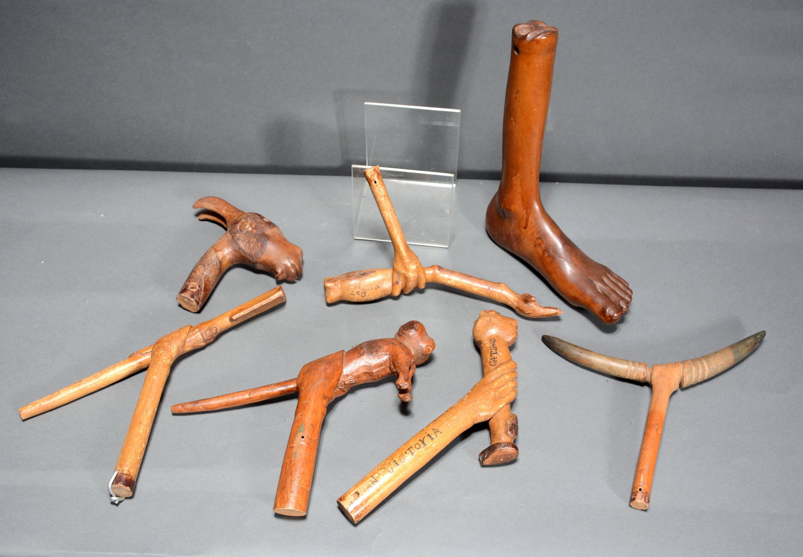Mileaus Beam. Seven Carved Objects.: Mileaus Beam. Seven Carved Objects. c. 1920's-40's. Subjects include chicken foot, human foot, cat and gun. Carved wood. All in good to great condition. Average size is 7" x 9". Est. $200-300. Ship: $