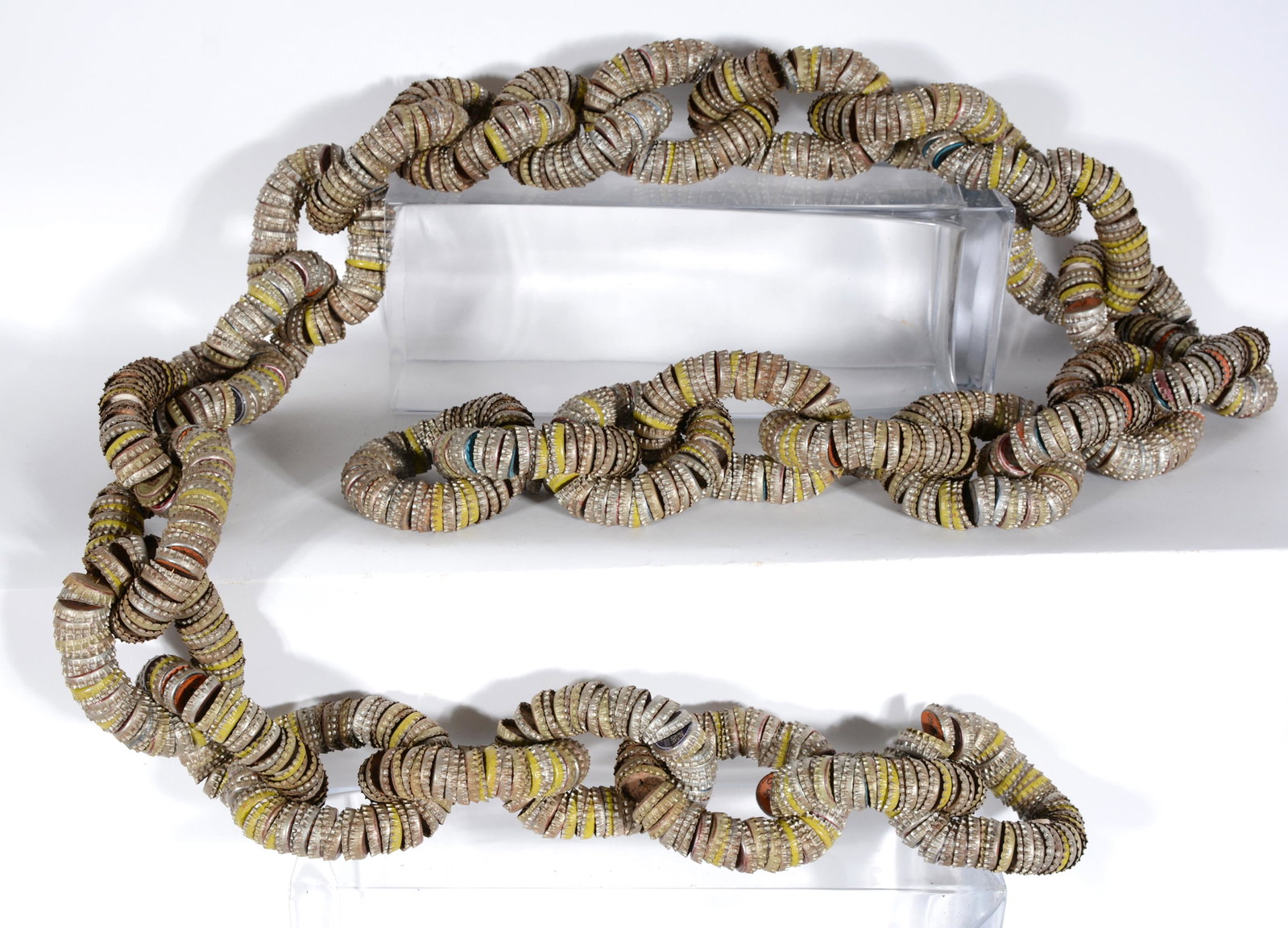 Bottlecap Chain.: Bottlecap Chain. c. 1960's. Bottlecaps and wire. Good condition. 91" long. Est. $200-400. Ship: $65